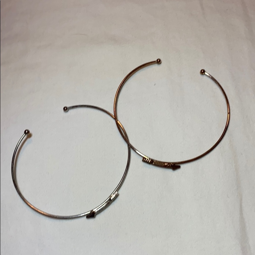 Two arrow bracelets.
